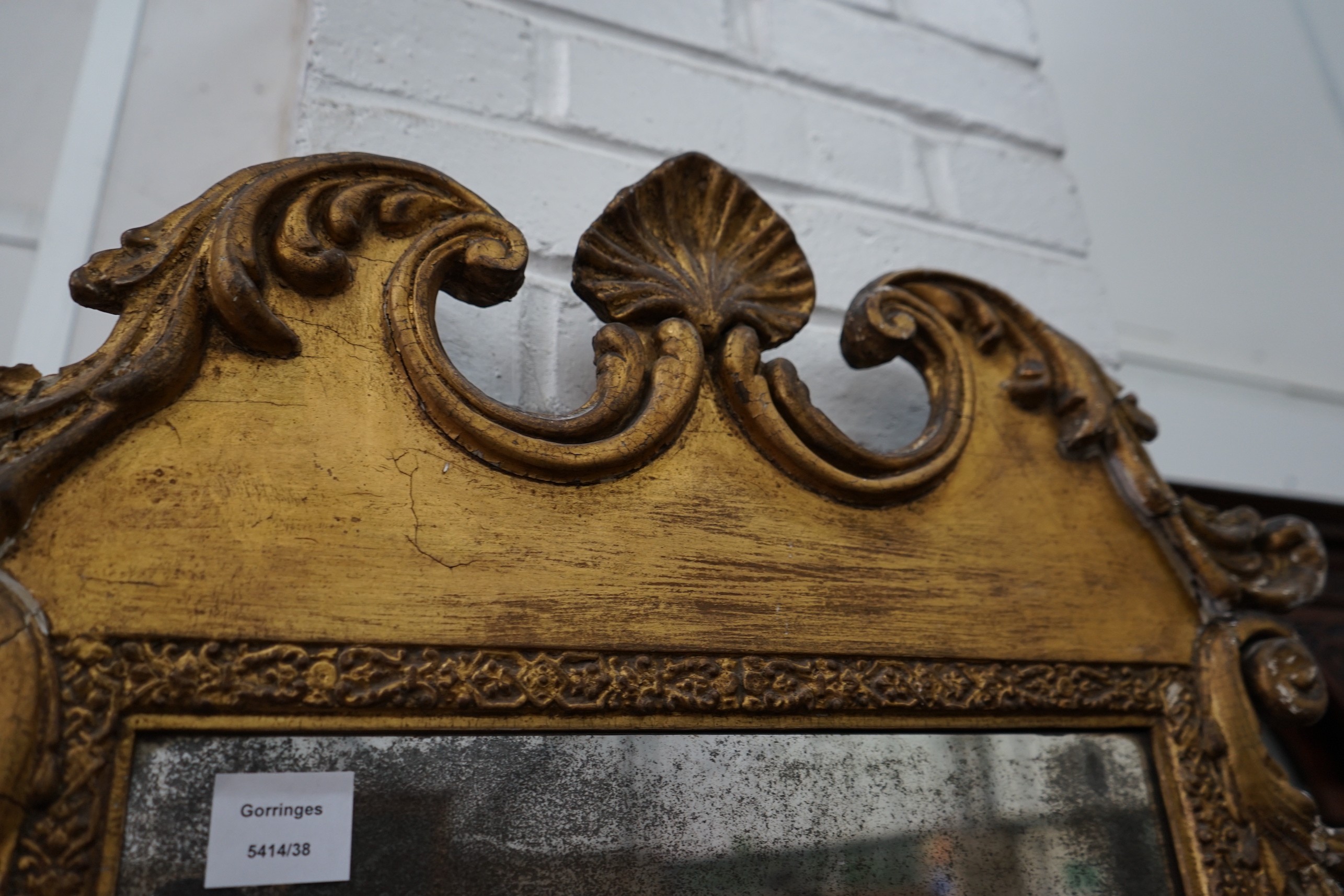 A 19th century carved giltwood wall mirror, width 61cm, height 110cm